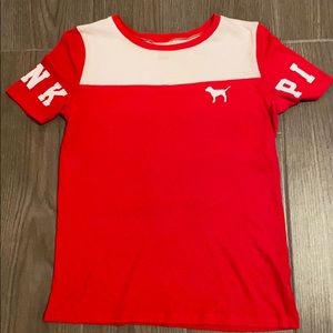 A red and white PINK ( brand ) shirt